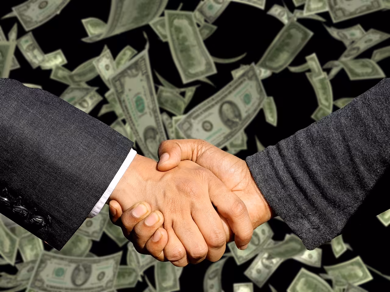 Person shaking hands after learning how to negotiate your salary